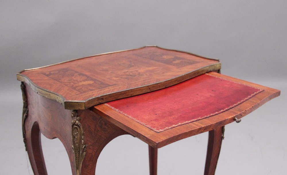 An early 20th-century French kingwood side table featuring slender cabriole legs, floral marquetry inlay, and gilt-metal mounts. View III