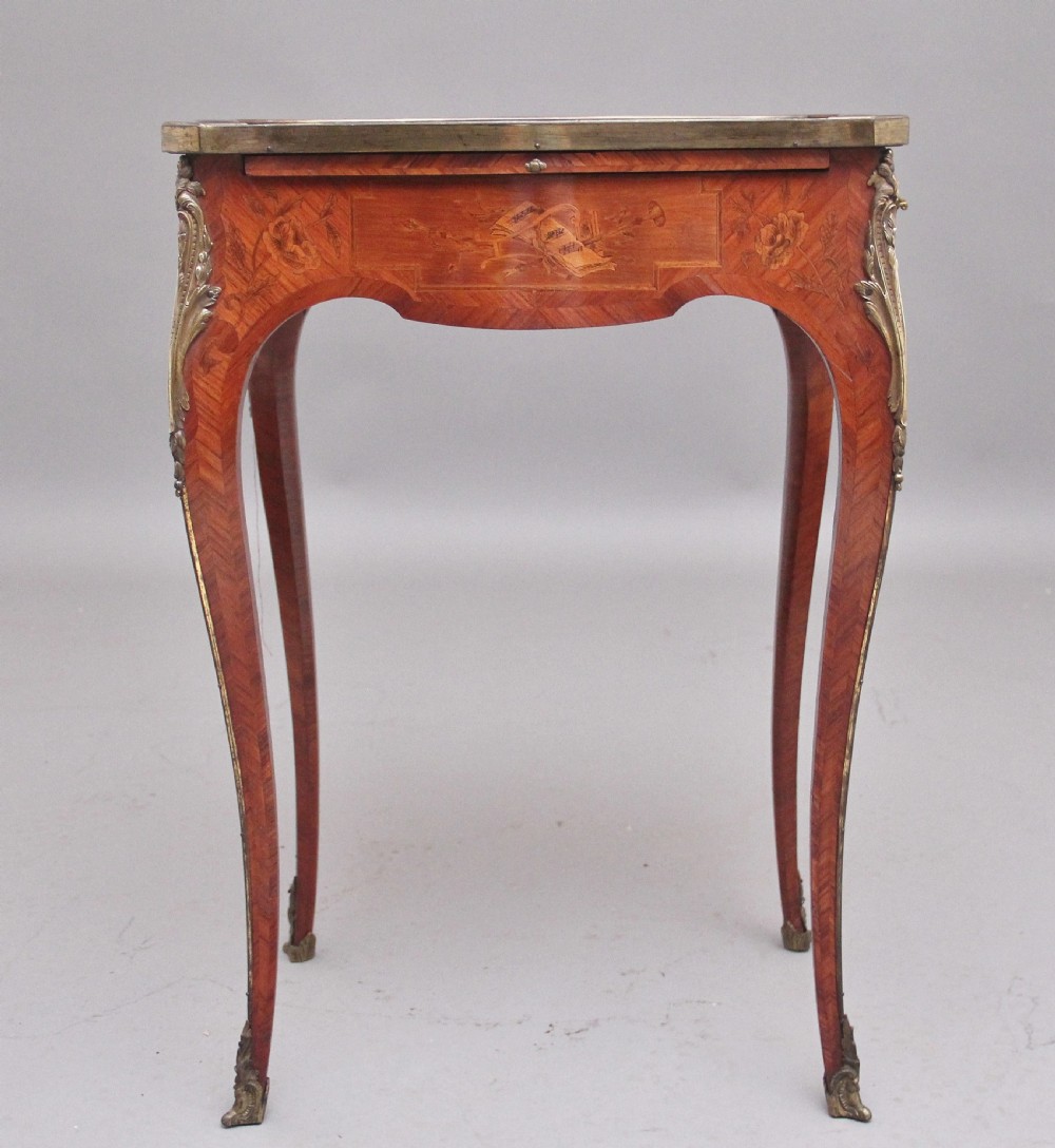An early 20th-century French kingwood side table featuring slender cabriole legs, floral marquetry inlay, and gilt-metal mounts. View IV