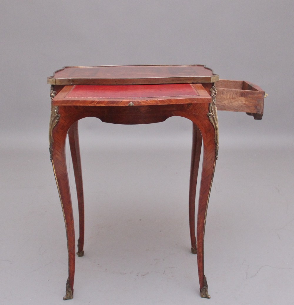 An early 20th-century French kingwood side table featuring slender cabriole legs, floral marquetry inlay, and gilt-metal mounts. View VI