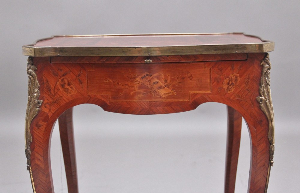 An early 20th-century French kingwood side table featuring slender cabriole legs, floral marquetry inlay, and gilt-metal mounts. View VII