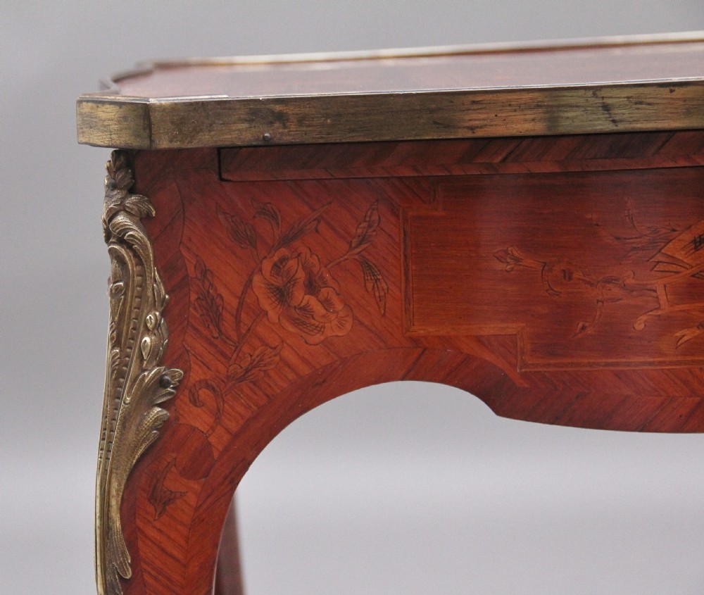 An early 20th-century French kingwood side table featuring slender cabriole legs, floral marquetry inlay, and gilt-metal mounts. View VIII