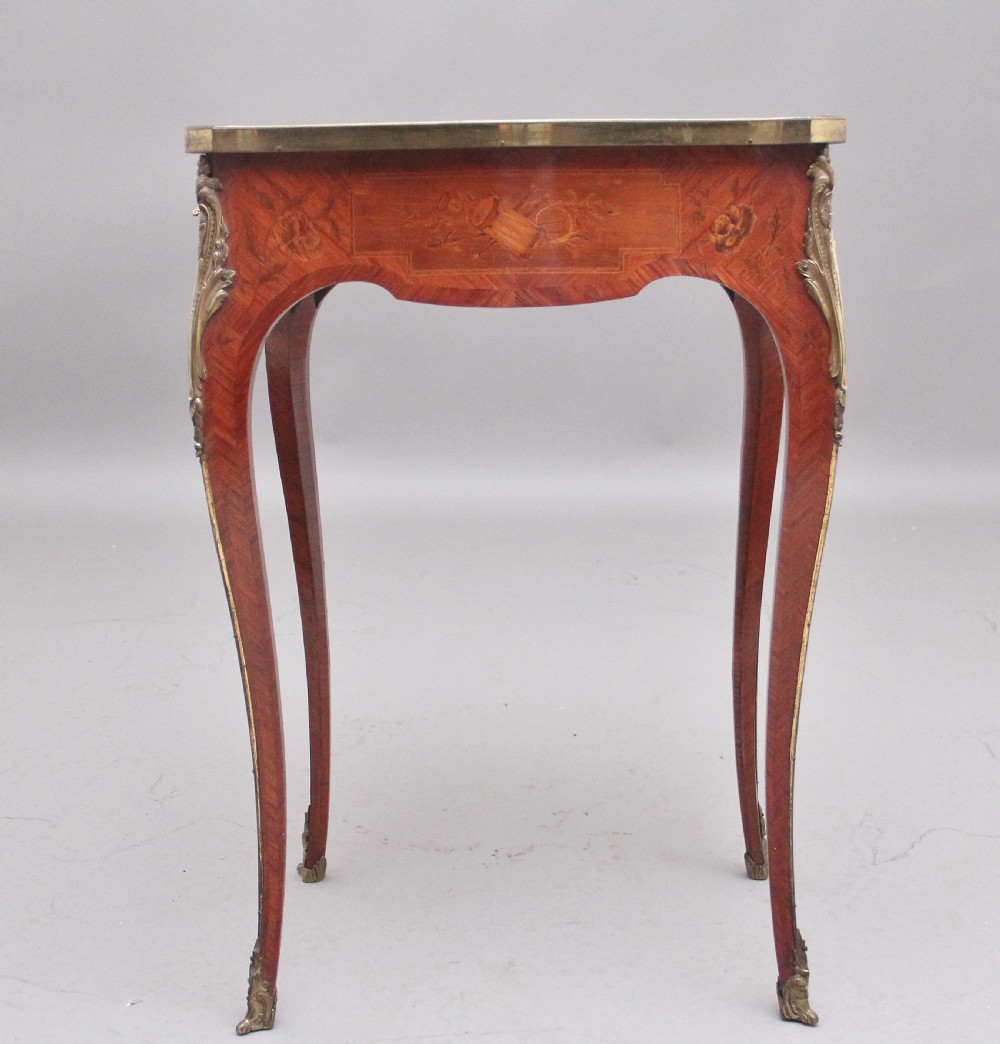 An early 20th-century French kingwood side table featuring slender cabriole legs, floral marquetry inlay, and gilt-metal mounts. View XI