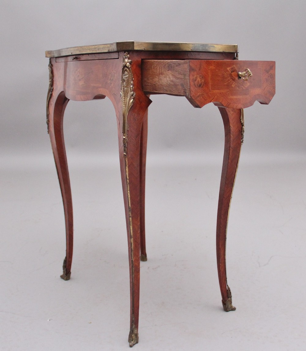 An early 20th-century French kingwood side table featuring slender cabriole legs, floral marquetry inlay, and gilt-metal mounts. View XIII