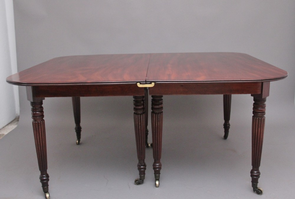 A large and impressive early 19th Century mahogany extending dining table