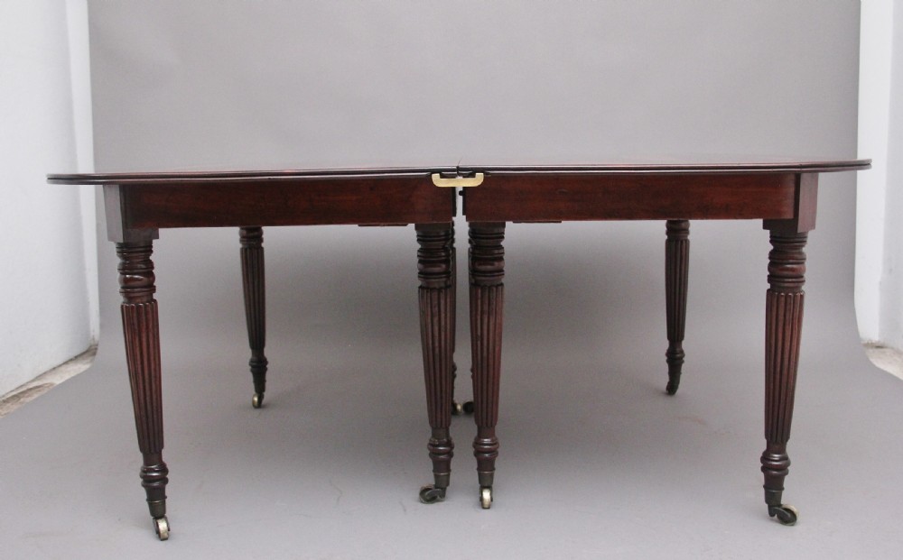 A large and impressive early 19th Century mahogany extending dining table View II