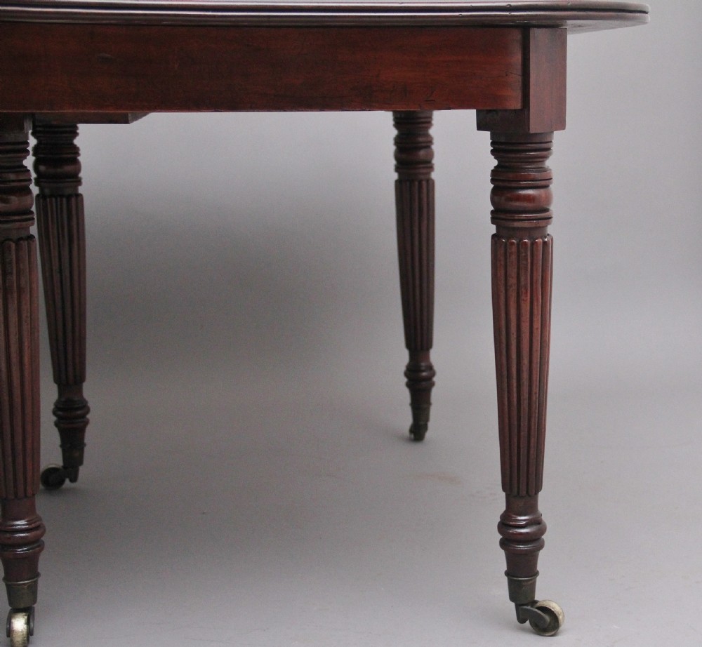 A large and impressive early 19th Century mahogany extending dining table View III