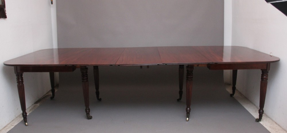 A large and impressive early 19th Century mahogany extending dining table View V