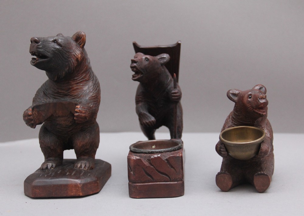 A set of three 19th Century black forest carvings of bears in different poses View II