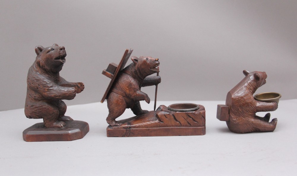 A set of three 19th Century black forest carvings of bears in different poses View III