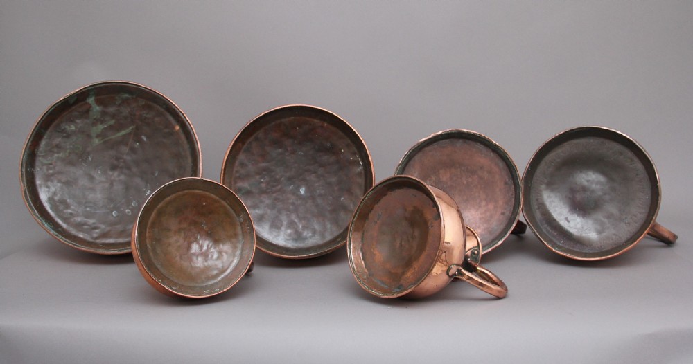 A set of six highly decorative 19th Century copper measuring jugs View VII
