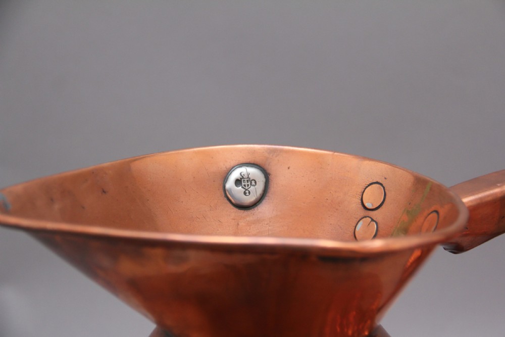 A set of six highly decorative 19th Century copper measuring jugs View VIII