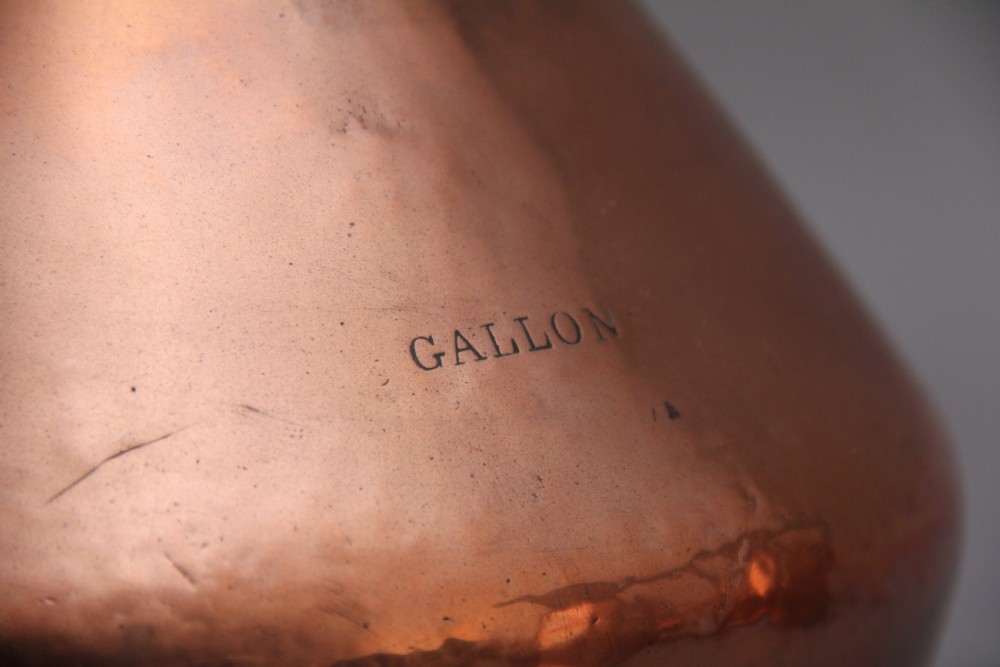 A set of six highly decorative 19th Century copper measuring jugs View XIV
