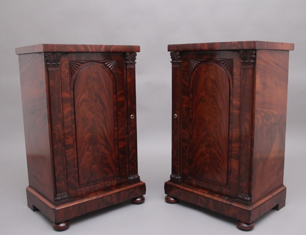 A pair of 19th Century flame mahogany bedside cabinets
