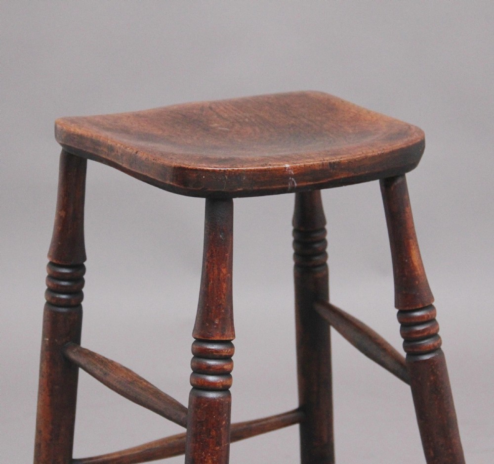 A tall mid 19th Century ash and elm stool View II