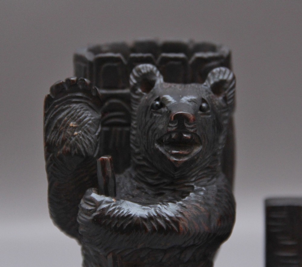 A set of three nineteenth-century hand-carved dark wood Black Forest bear figures, including two standing bears and one central desk accessory bear. View VI