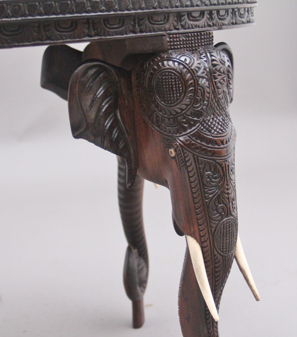 A superb quality 19th Century Anglo-Indian carved elephant occasional table View X