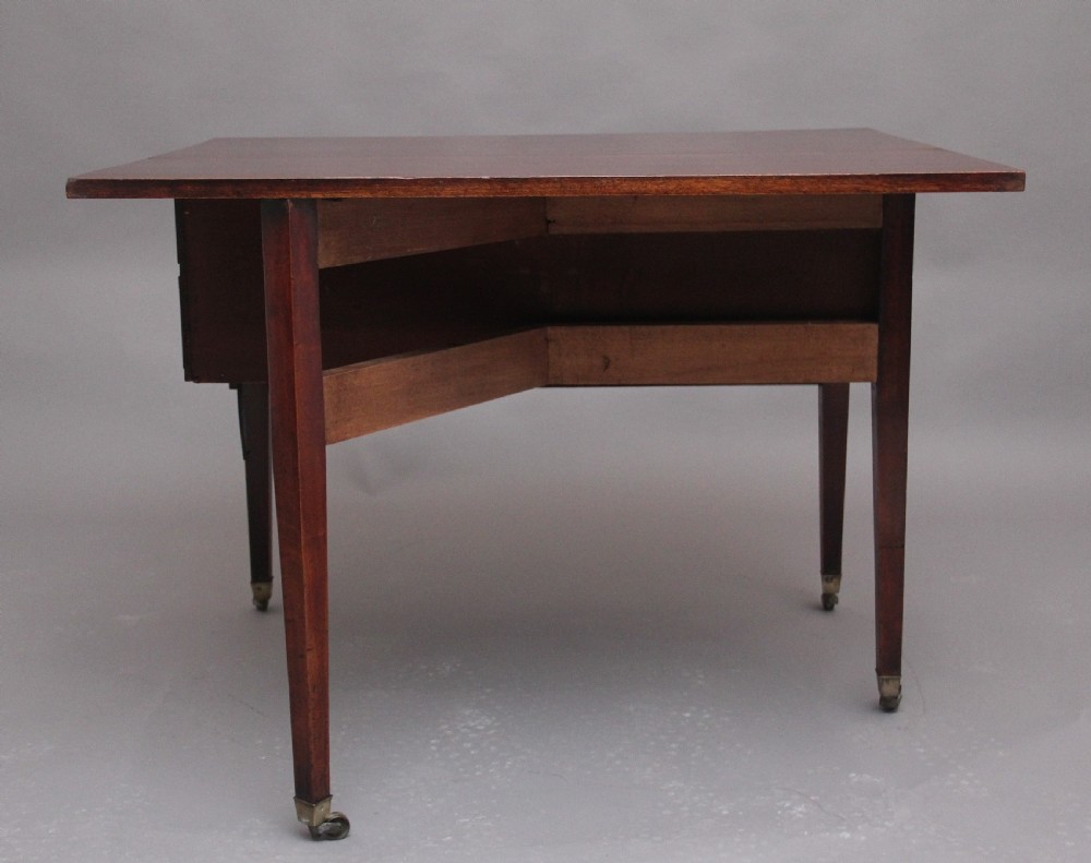 An 18th-century mahogany drop-leaf side table featuring two end drawers with brass bail handles and square tapered legs ending in brass castors. View XII
