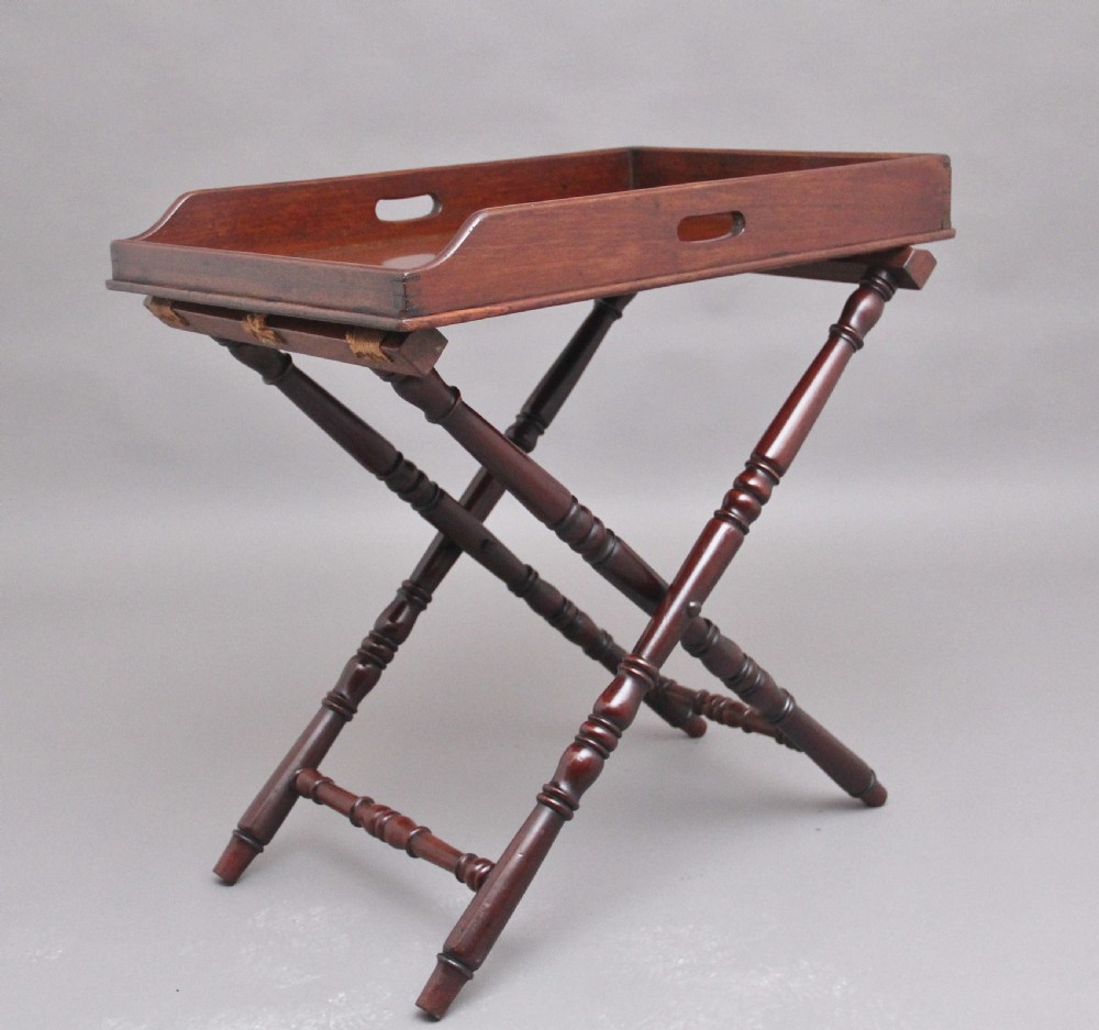 A lovely quality early 19th Century mahogany butlers tray on stand
