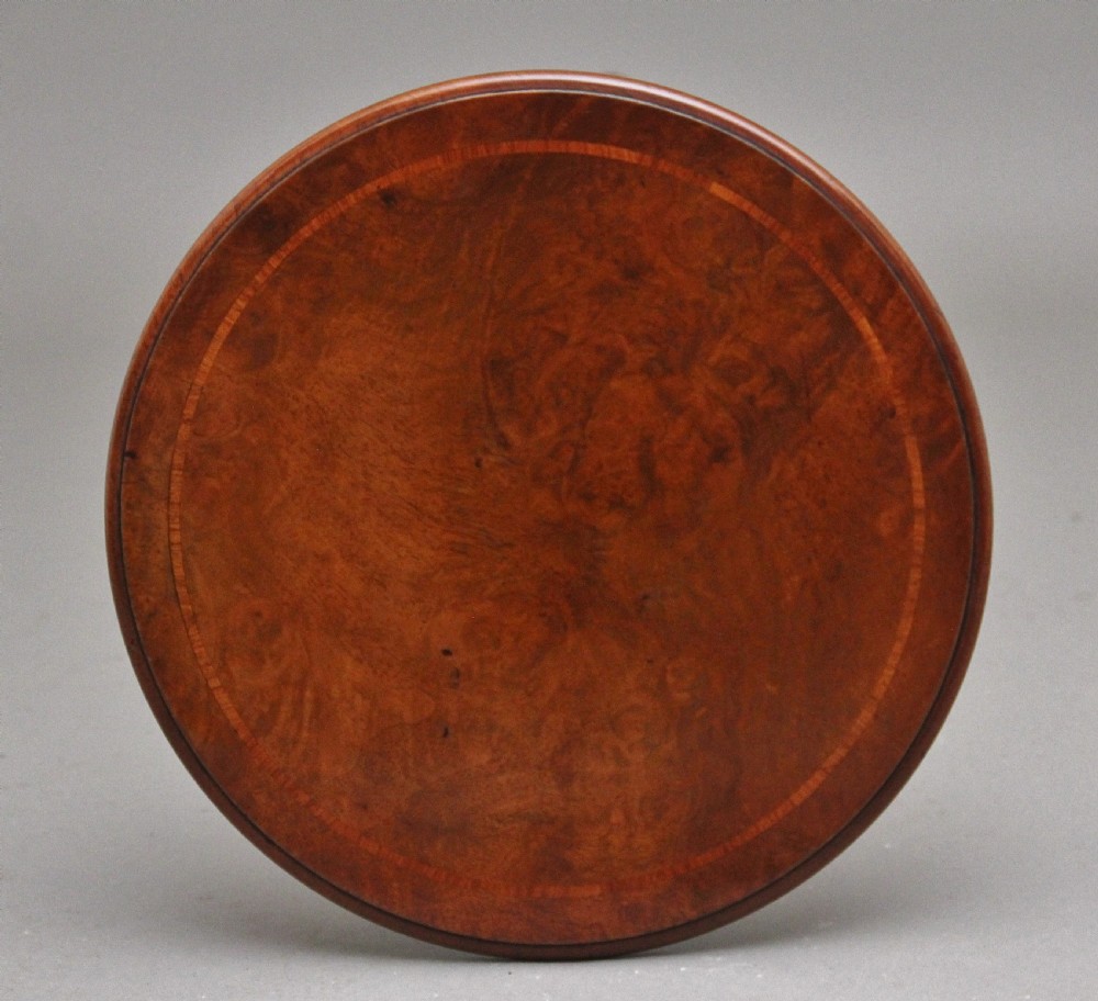 A 19th-century Victorian walnut wine table featuring a circular top, a barley twist column, and a carved tripod base with scroll feet. View III