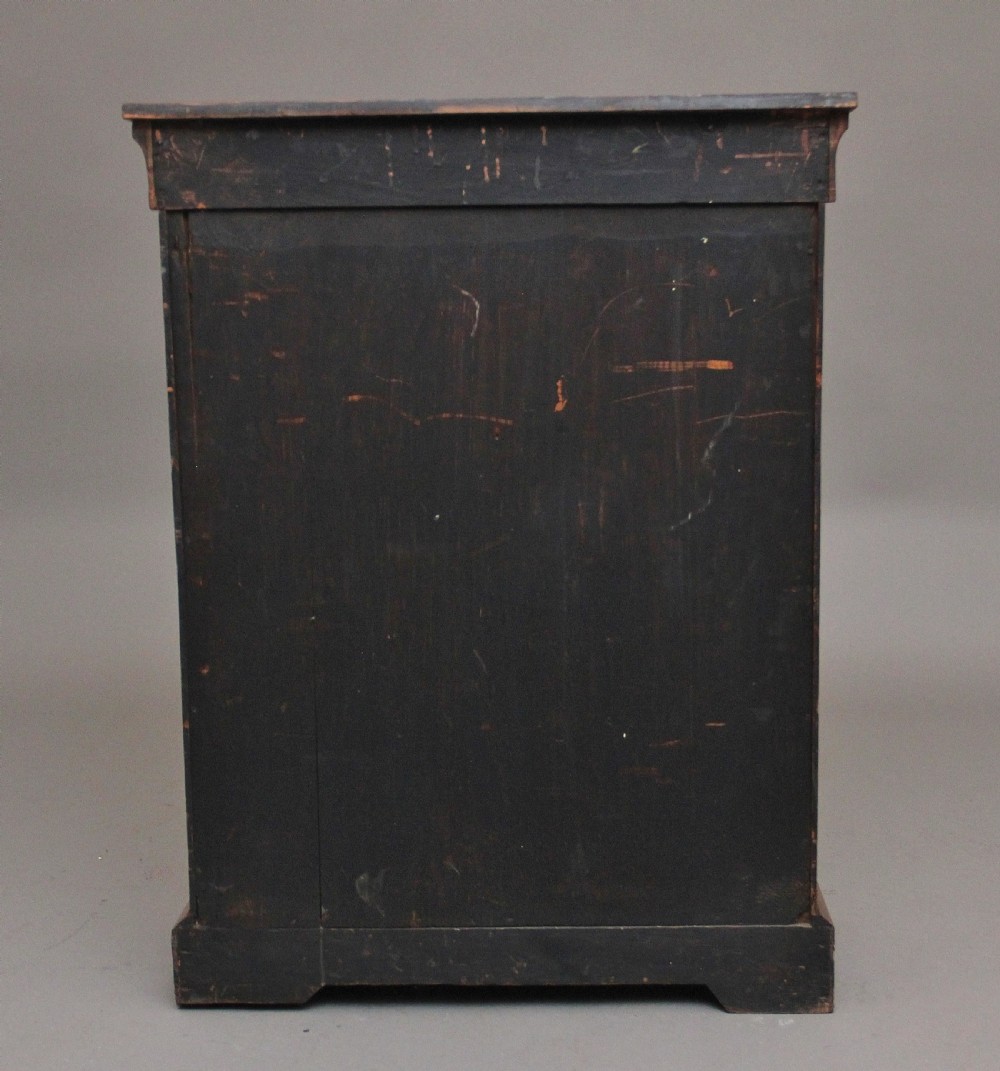 A 19th-century walnut pier cabinet featuring floral marquetry inlays, decorative brass mounts, and a single glazed door revealing fitted shelves. View VI