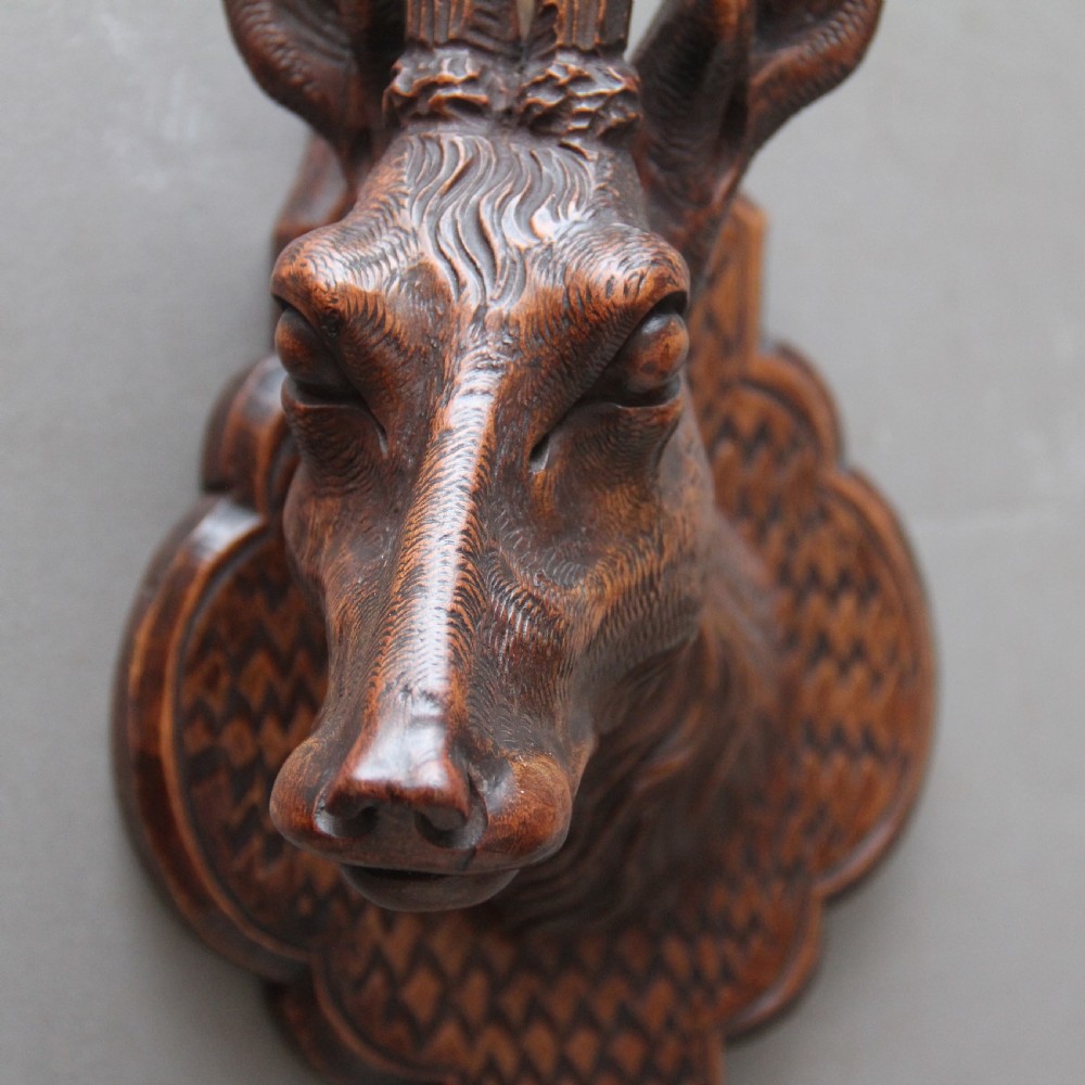 A pair of decorative 19th Century carved walnut black forest deer heads View II