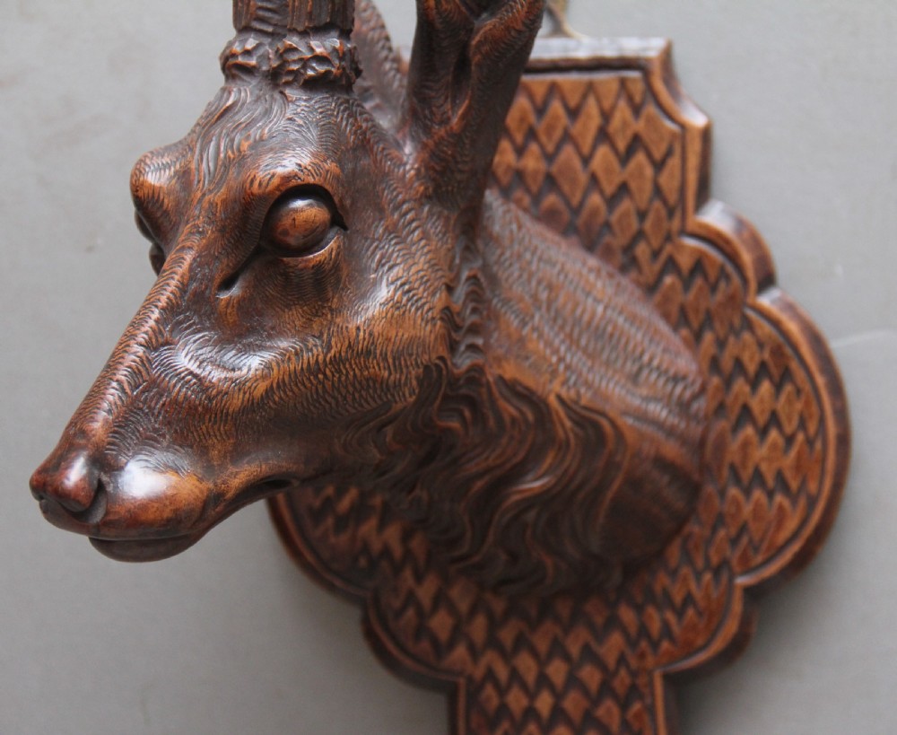 A pair of decorative 19th Century carved walnut black forest deer heads View III
