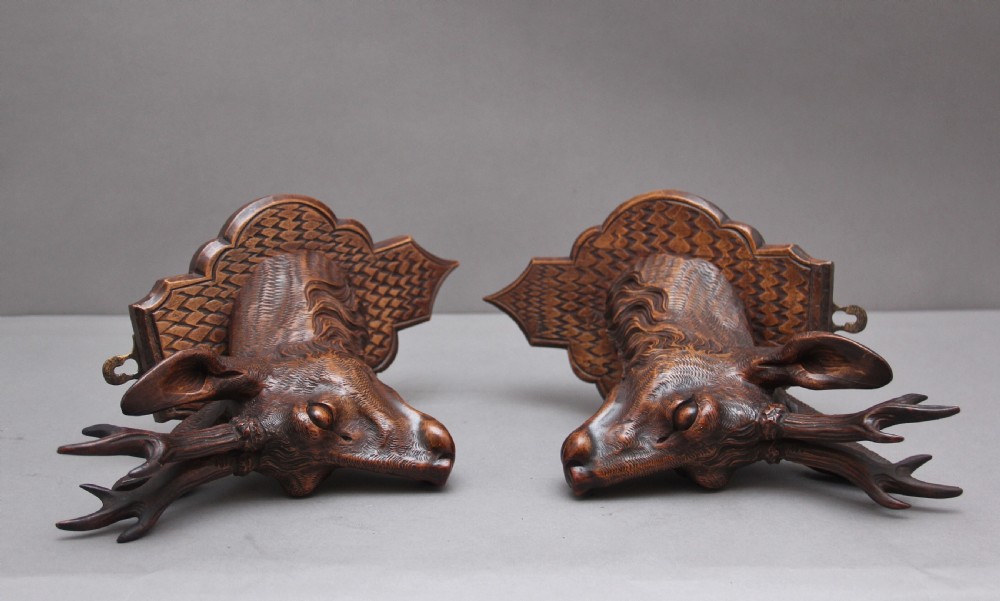 A pair of decorative 19th Century carved walnut black forest deer heads View XII