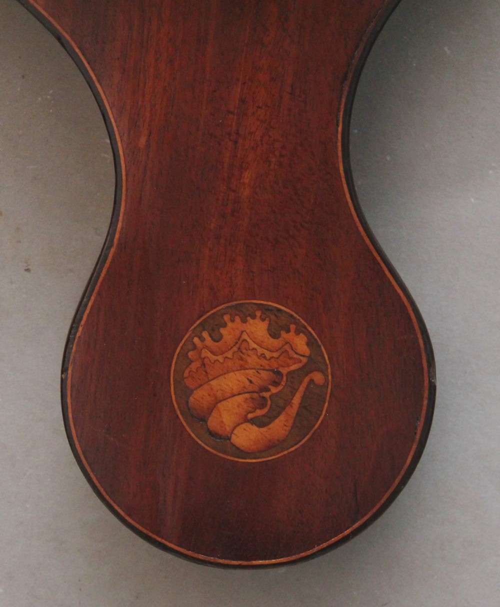 A 19th-century mahogany banjo barometer featuring shell marquetry inlays, a thermometer housing, a broken arch pediment, and a silvered dial. View VII
