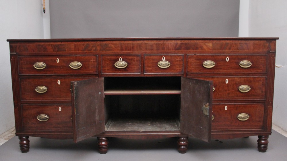 large early 19th Century mahogany and boxwood strung dresser base View II