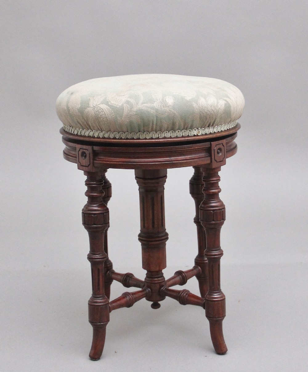 19th Century walnut piano stool with an adjustable seat