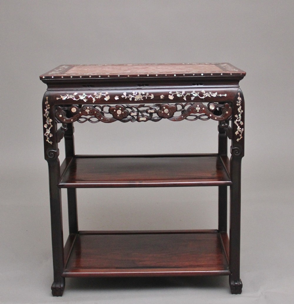 A dark hardwood Chinese three-tier occasional table featuring intricate mother-of-pearl floral inlay and a pink mottled marble top inset. View II