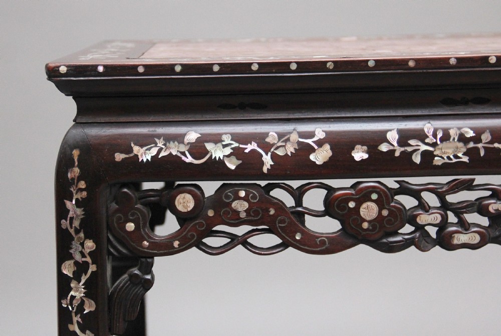 A dark hardwood Chinese three-tier occasional table featuring intricate mother-of-pearl floral inlay and a pink mottled marble top inset. View V