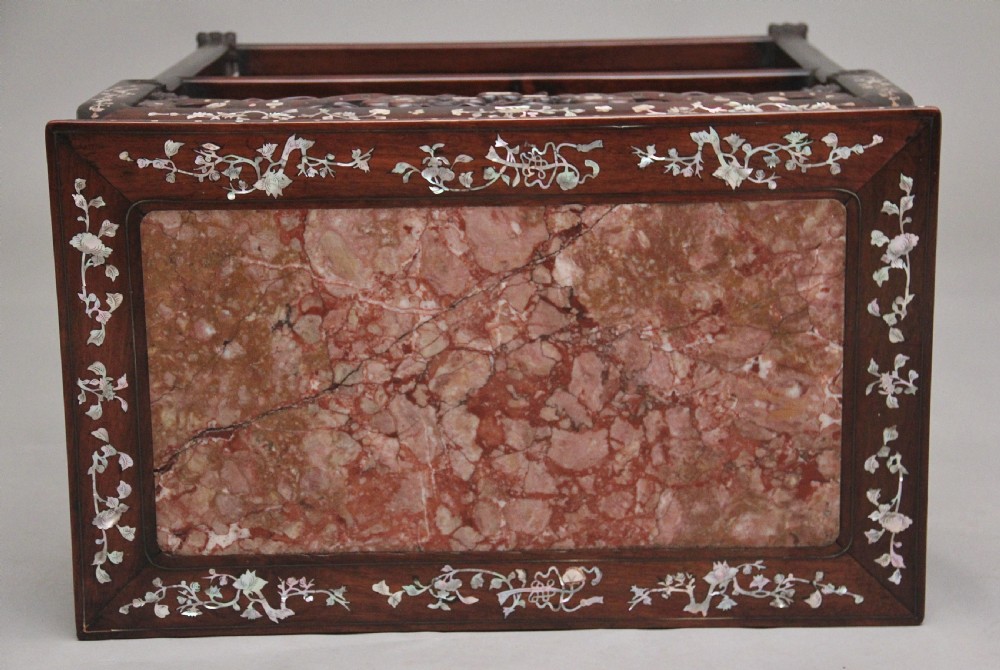 A dark hardwood Chinese three-tier occasional table featuring intricate mother-of-pearl floral inlay and a pink mottled marble top inset. View X