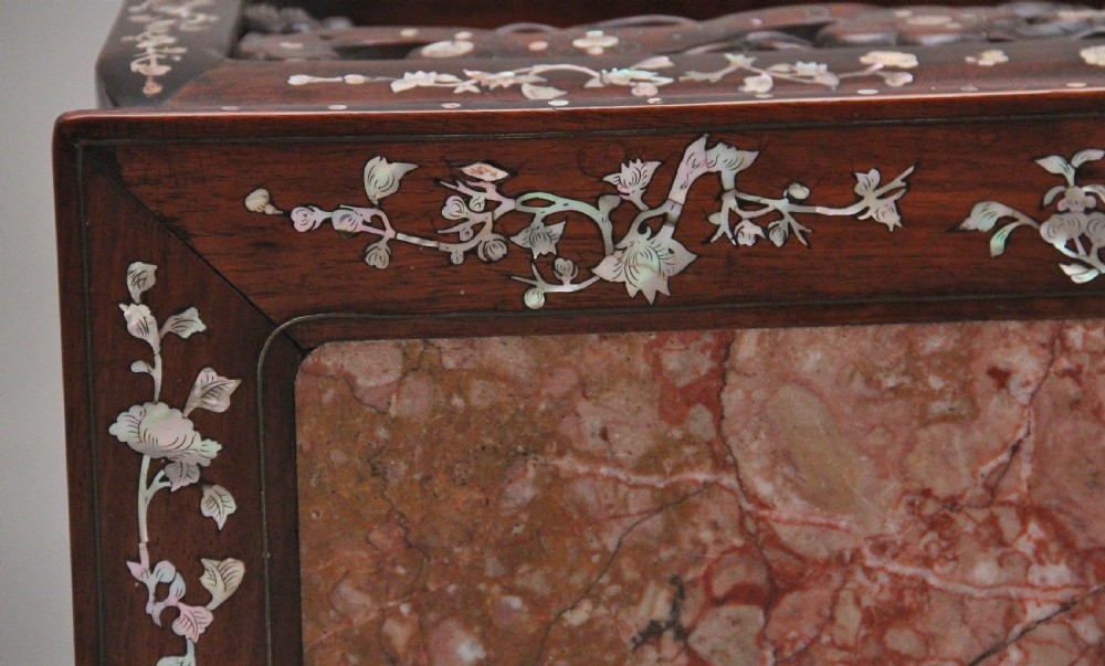 A dark hardwood Chinese three-tier occasional table featuring intricate mother-of-pearl floral inlay and a pink mottled marble top inset. View XI