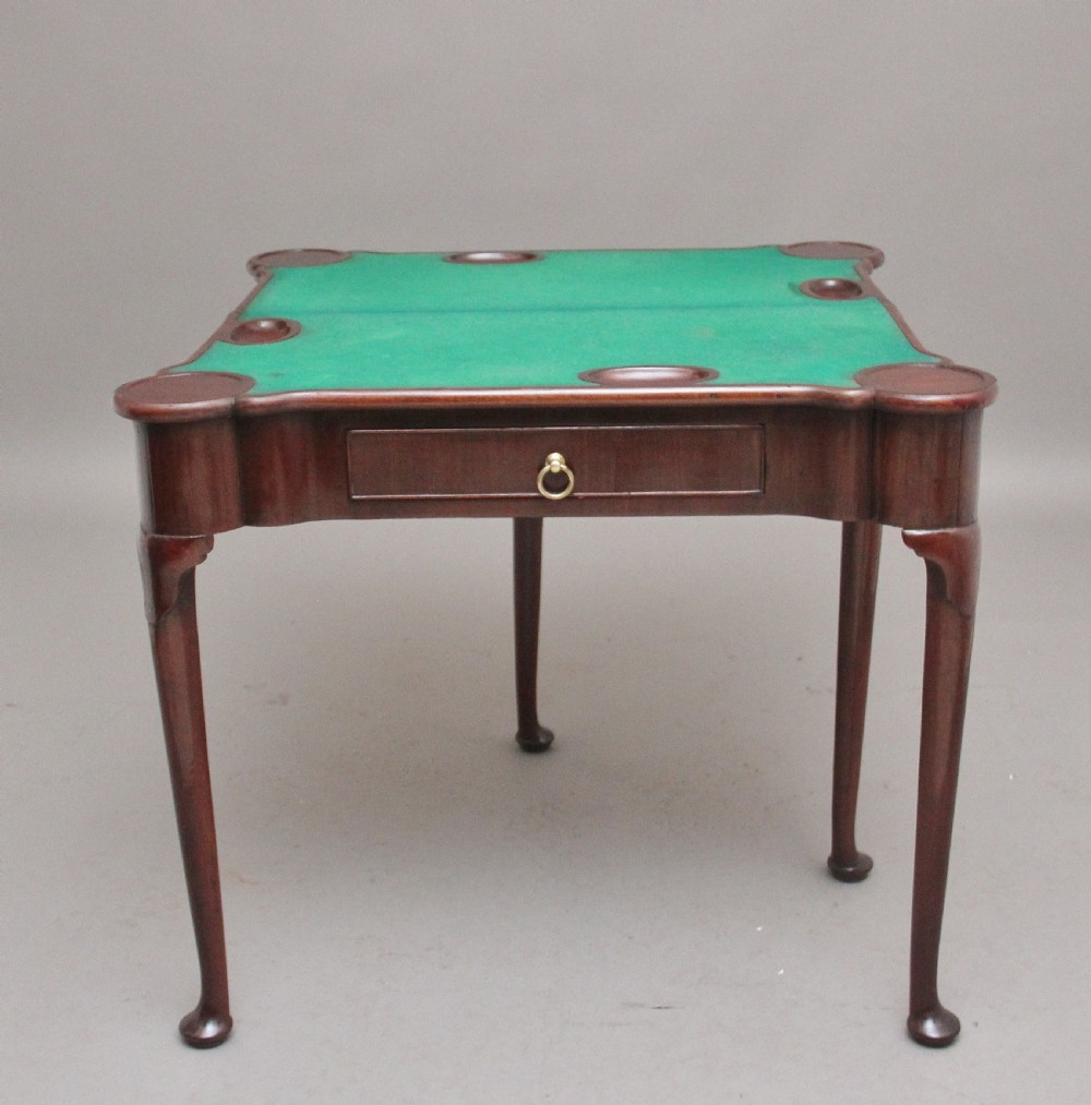 A mid-18th-century mahogany card table featuring a fold-over top, a single frieze drawer with a brass ring handle, and cabriole legs with pad feet. View XI