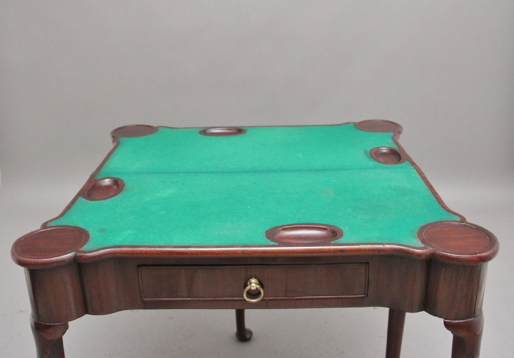 A mid-18th-century mahogany card table featuring a fold-over top, a single frieze drawer with a brass ring handle, and cabriole legs with pad feet. View XII
