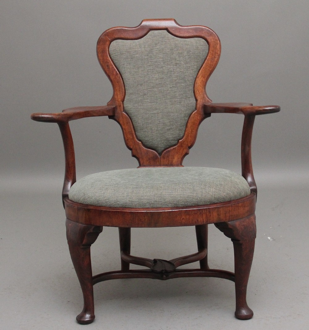 A fabulous quality and very rare George II walnut armchair View VI