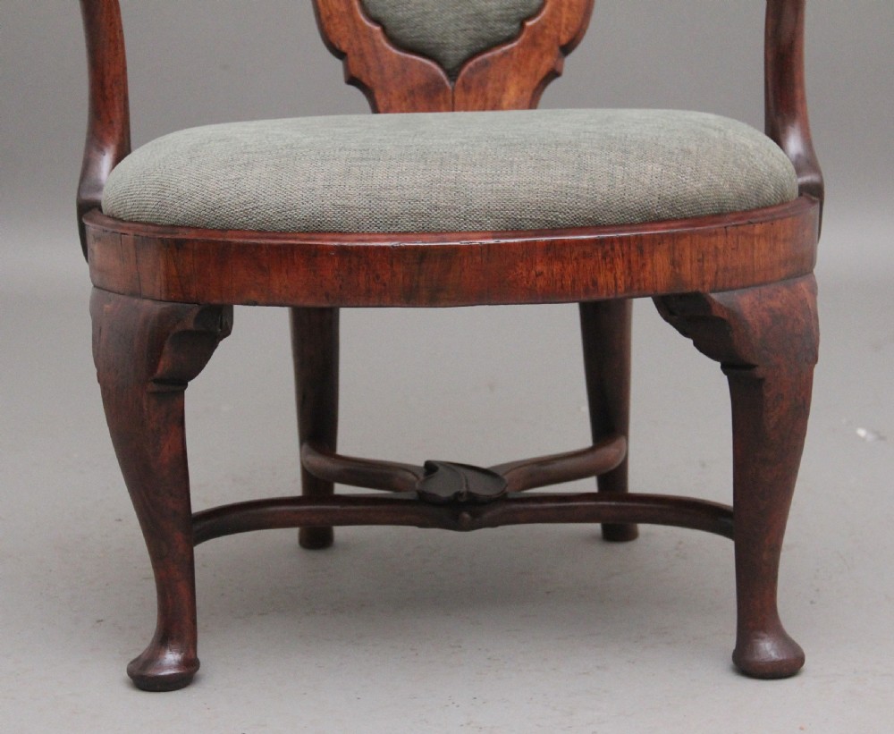 A fabulous quality and very rare George II walnut armchair View VIII