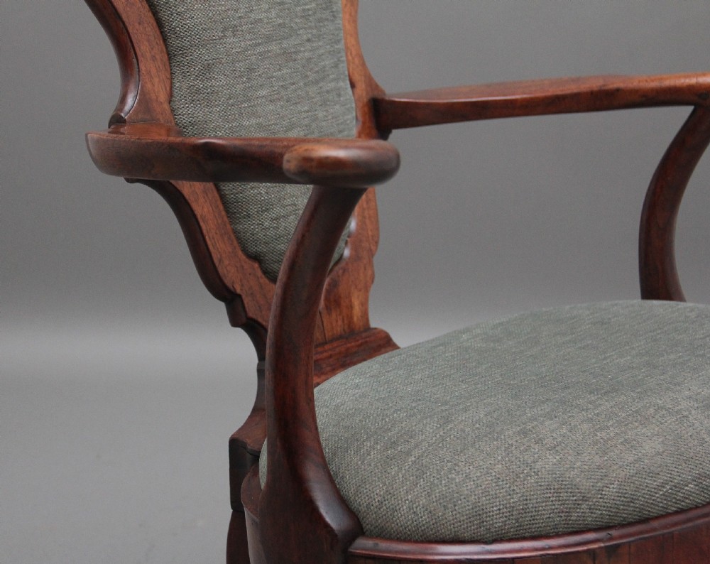 A fabulous quality and very rare George II walnut armchair View X