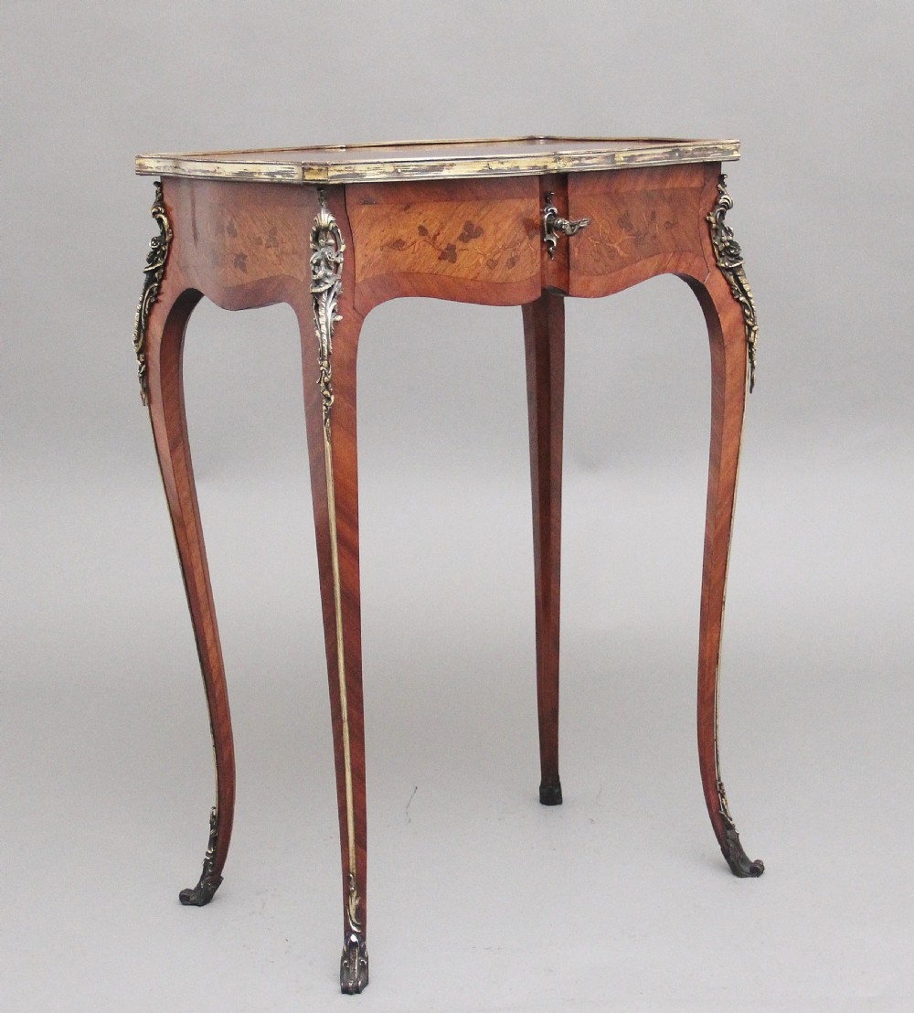 A 19th-century French kingwood side table featuring floral marquetry inlay, slender cabriole legs, and ornate gilt-metal mounts. View II