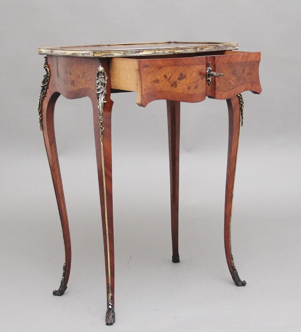 A 19th-century French kingwood side table featuring floral marquetry inlay, slender cabriole legs, and ornate gilt-metal mounts. View III