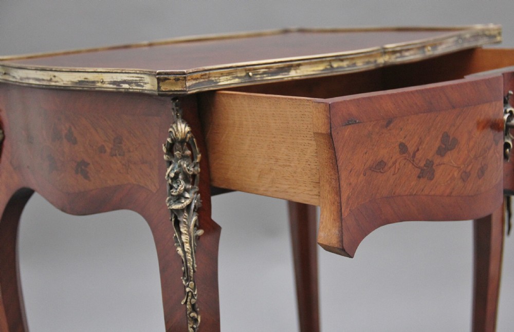 A 19th-century French kingwood side table featuring floral marquetry inlay, slender cabriole legs, and ornate gilt-metal mounts. View IV