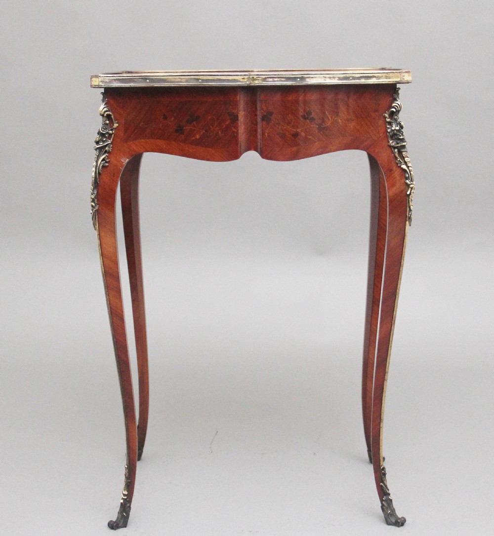 A 19th-century French kingwood side table featuring floral marquetry inlay, slender cabriole legs, and ornate gilt-metal mounts. View VI