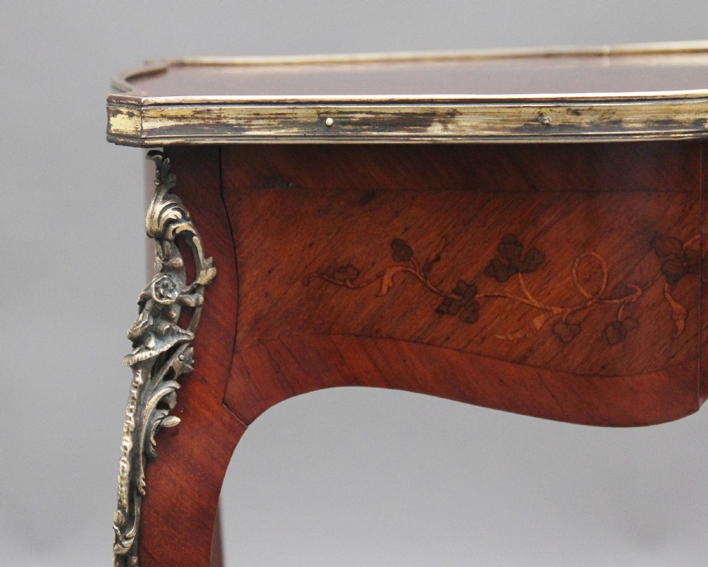 A 19th-century French kingwood side table featuring floral marquetry inlay, slender cabriole legs, and ornate gilt-metal mounts. View XI