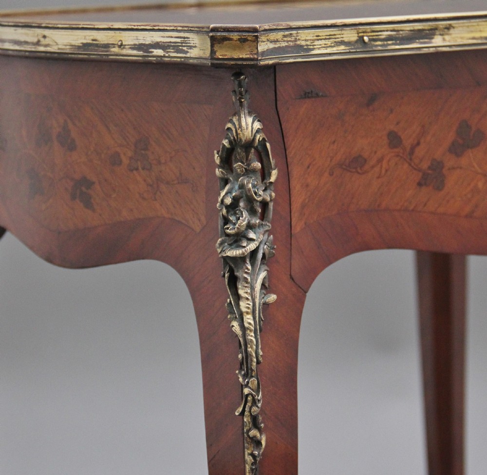 A 19th-century French kingwood side table featuring floral marquetry inlay, slender cabriole legs, and ornate gilt-metal mounts. View XII