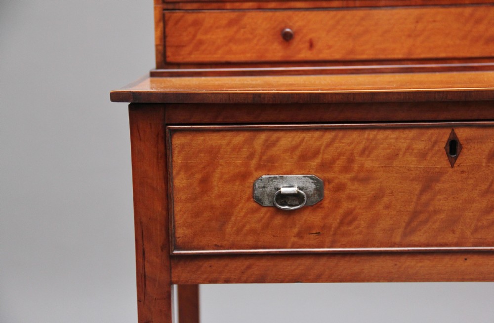 A 19th-century satinwood ladies writing table featuring a raised gallery back with small drawers, a single frieze drawer, square tapered legs, and a curved lower shelf. View XIII