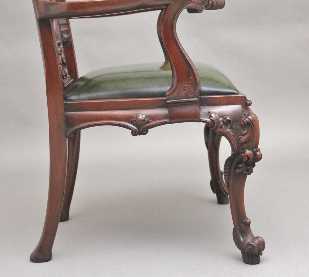 A highly decorative early 20th Century carved mahogany armchair in the Chippendale style View III