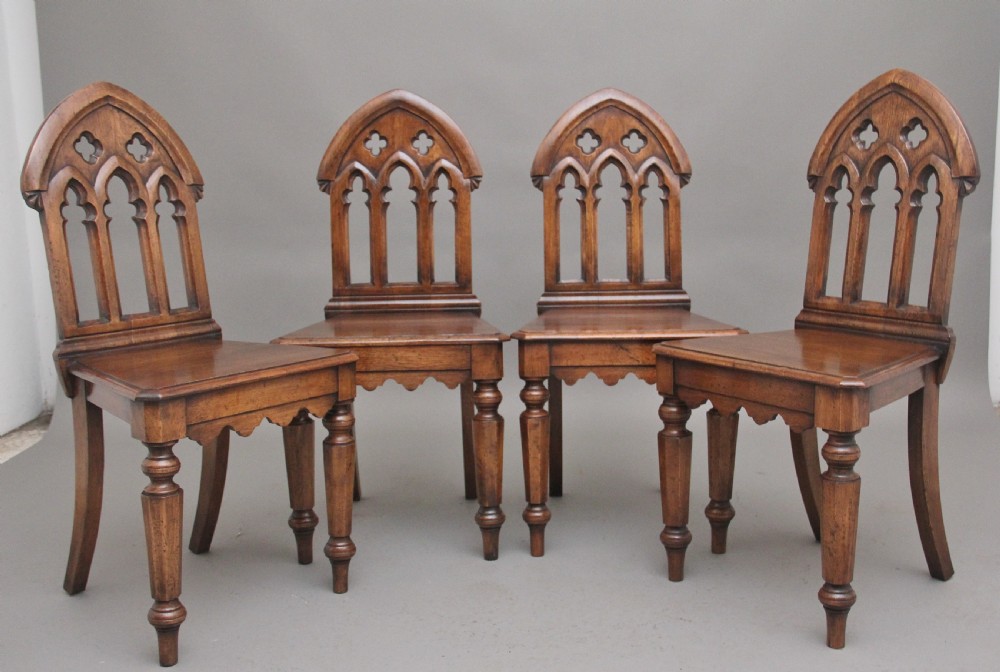 Set of four early 20th Century Gothic style hall chairs