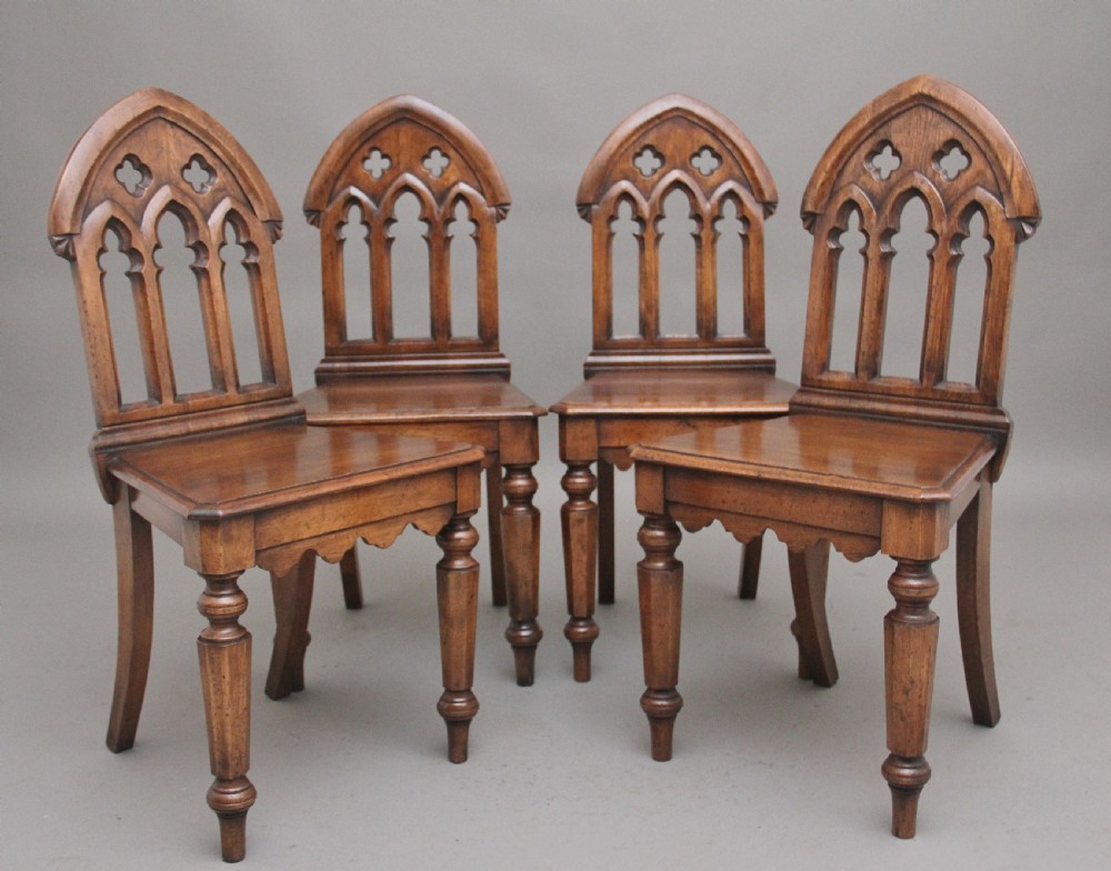 Set of four early 20th Century Gothic style hall chairs View II