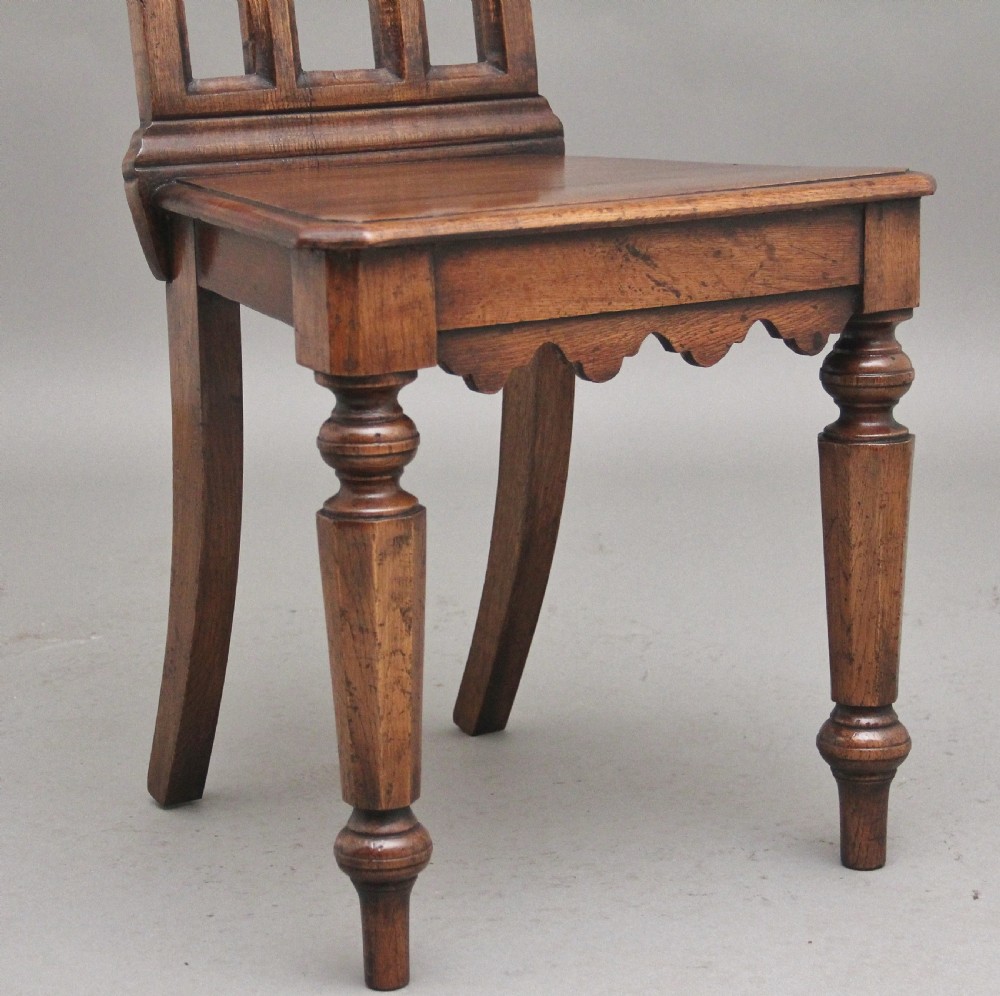 Set of four early 20th Century Gothic style hall chairs View VI
